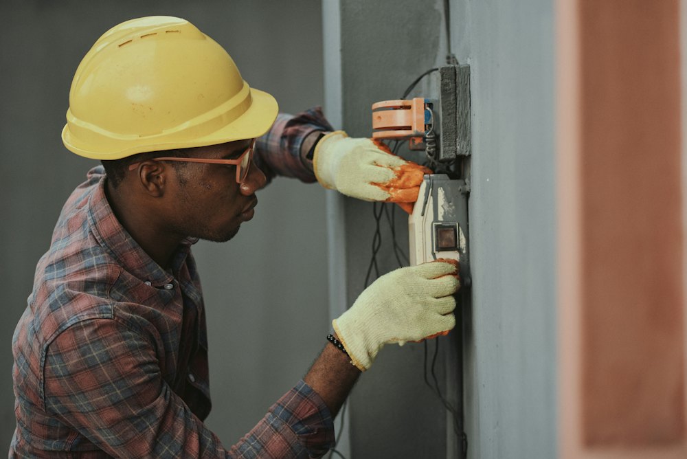 Technician working on a home electrical panel